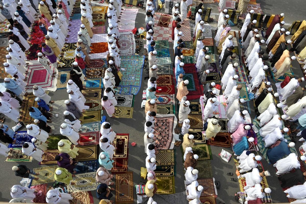 Muslims offered Eid prayers at Eidgahs and mosques and greeted each other. AFP Photo