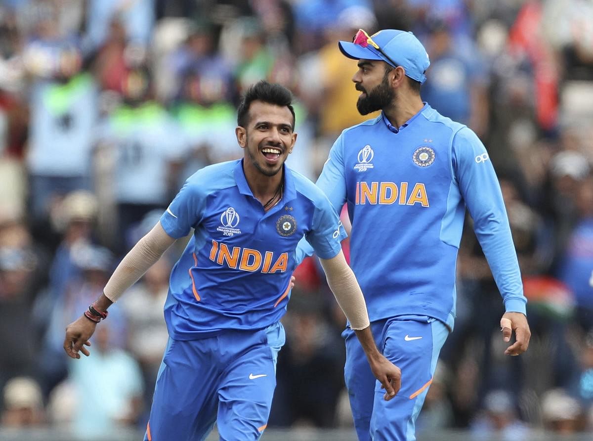 BRILLIANT SHOW: India's Yuzvendra Chahal (left) celebrates the dismissal of South Africa's Rassie van der Dussen during their World Cup game in Southampton. AP/PTI