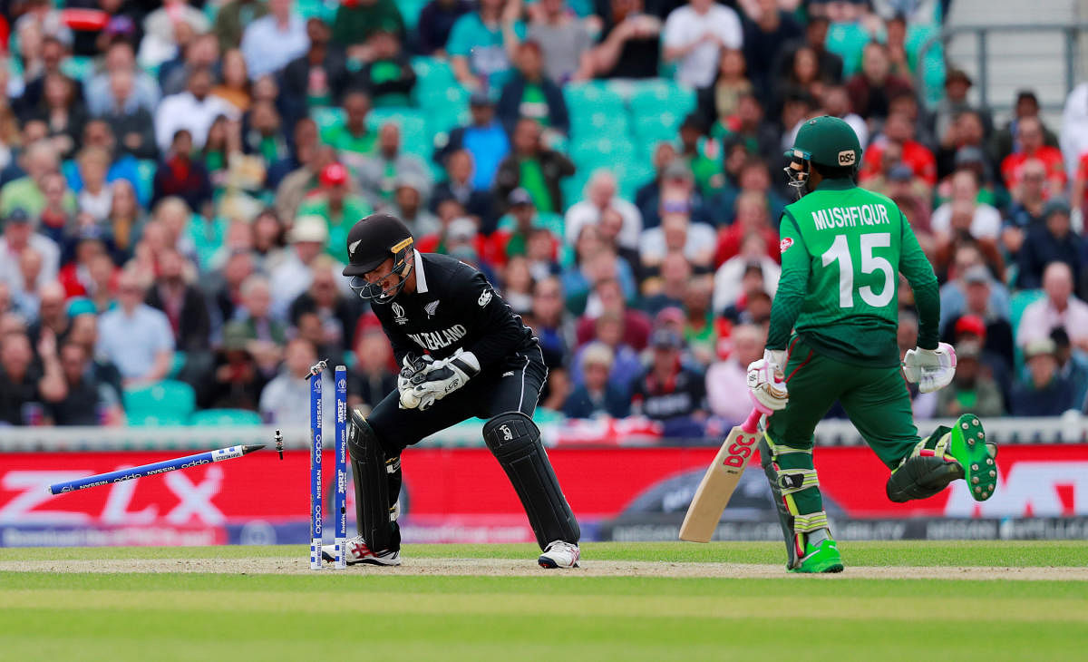 Bangladesh's Mushfiqur Rahim is run out by New Zealand's Tom Latham. (Action Images via Reuters)