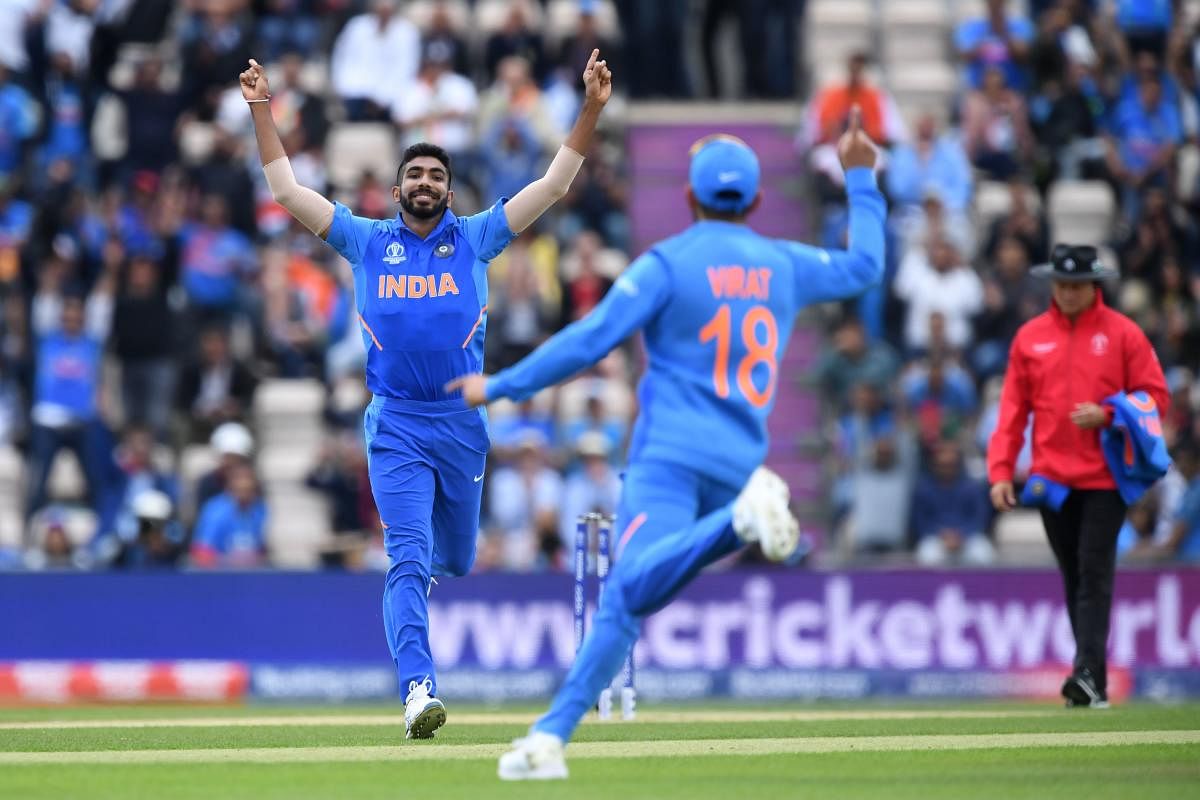 Jasprit Bumrah (L) celebrates with India's captain Virat Kohli after dismissing South Africa's Hashim Amla for six during the 2019 Cricket World Cup group stage match between South Africa and India at the Rose Bowl in Southampton, southern England, on June 5, 2019. AFP