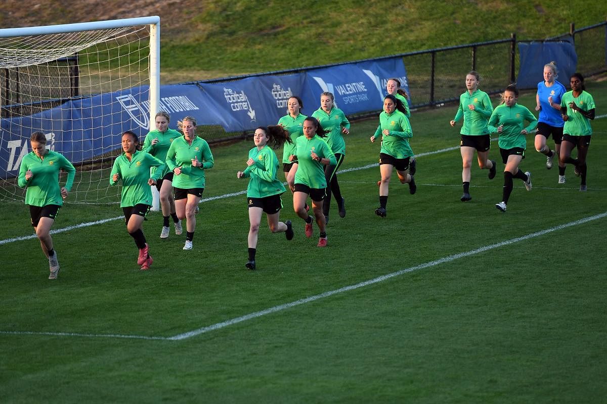 This picture taken on May 29, 2019 shows members of Australia's women's football team warming up during a training session in Sydney. (AFP)