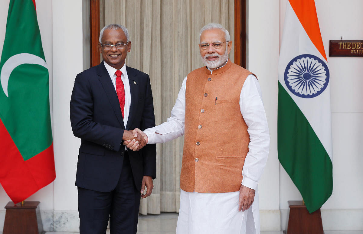Maldives President Solih and India's PM Modi shake hands ahead of their meeting in New Delhi in this dated file photo. (December 17, 2018)  Reuters. 