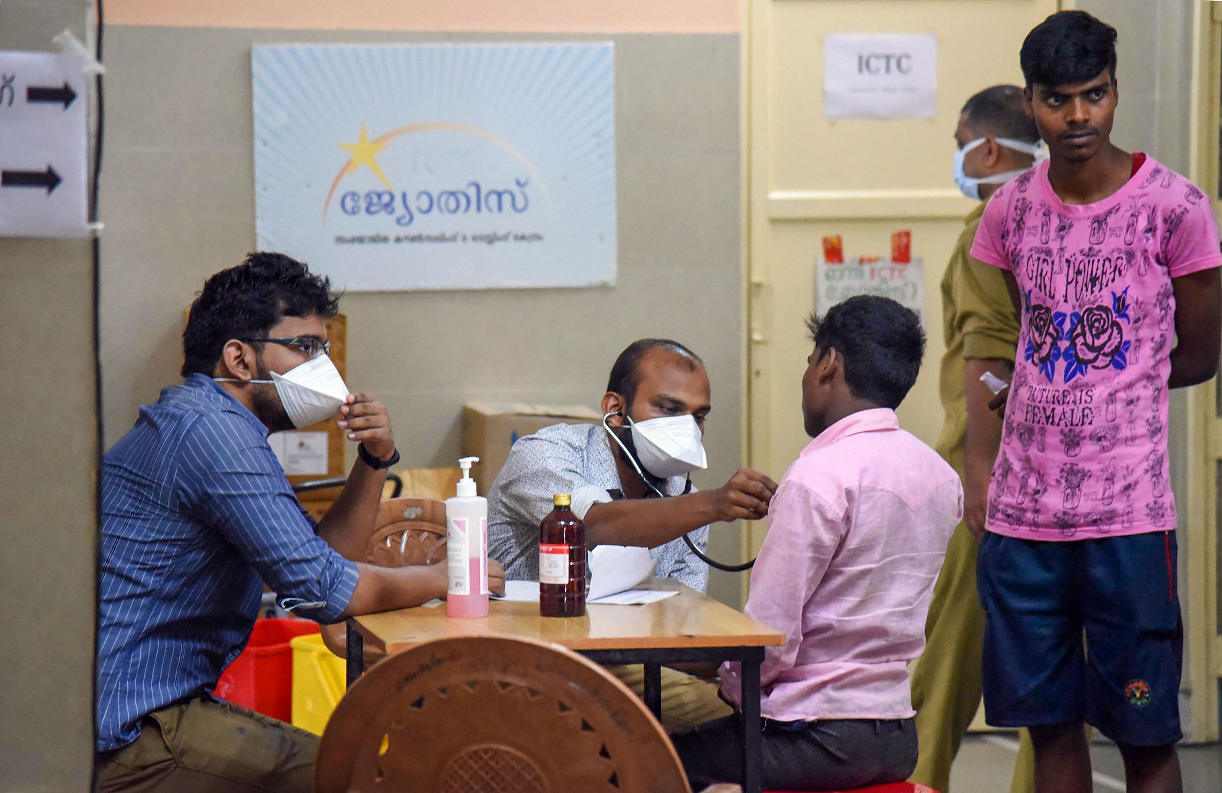 Doctors check for Nipah symptoms at a hospital in Kochi. Using masks around a patient is recommended.