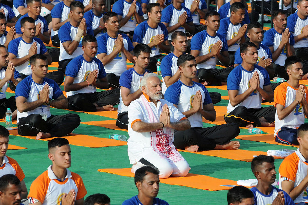 Indian Prime Minister Narendra Modi performs yoga on International Yoga Day in Dehradun in Uttarakhand. Reuters photo.