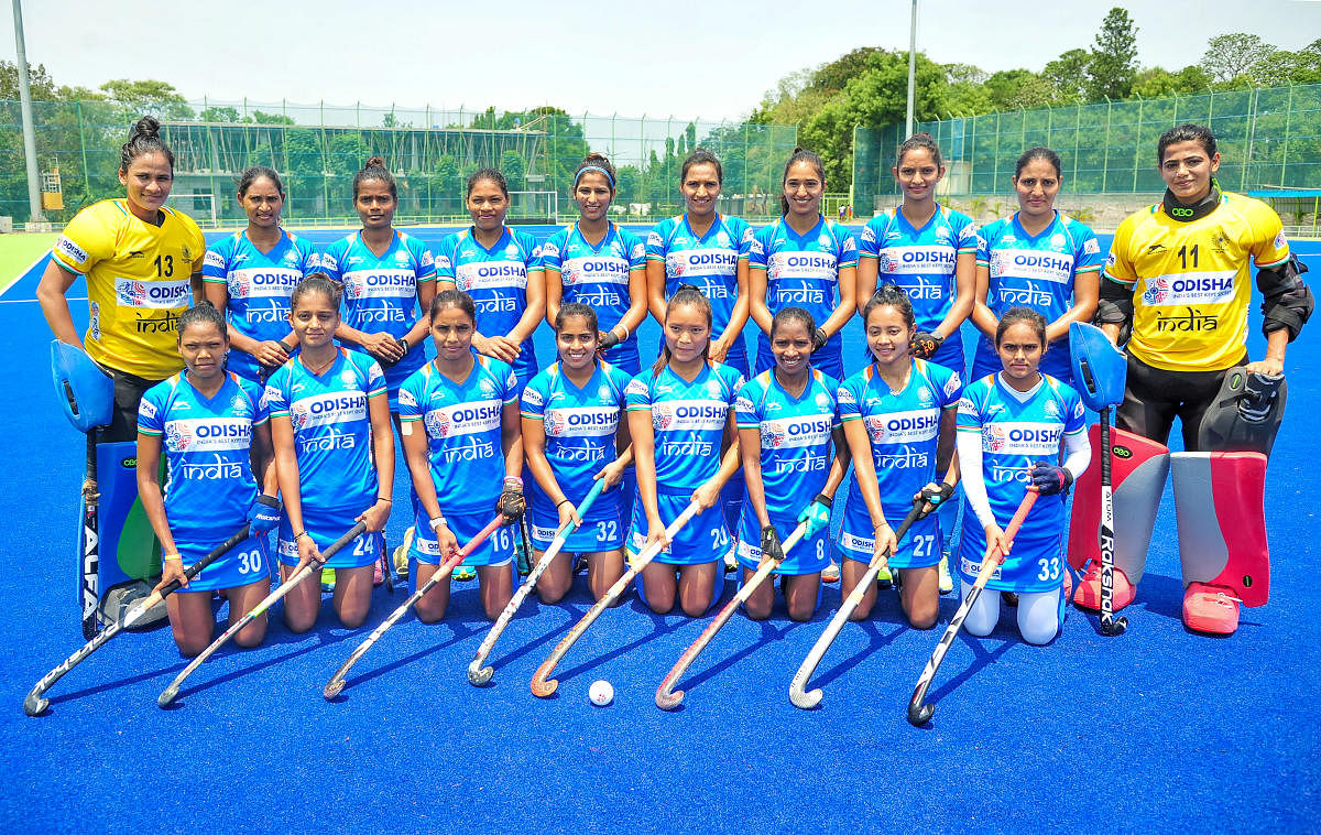 Indian Women hockey players don their new jersey as they pose for a group photo during a practice session ahead of the FIH Women's Series finals, at Sports Authority of India (SAI). (PTI File Photo)