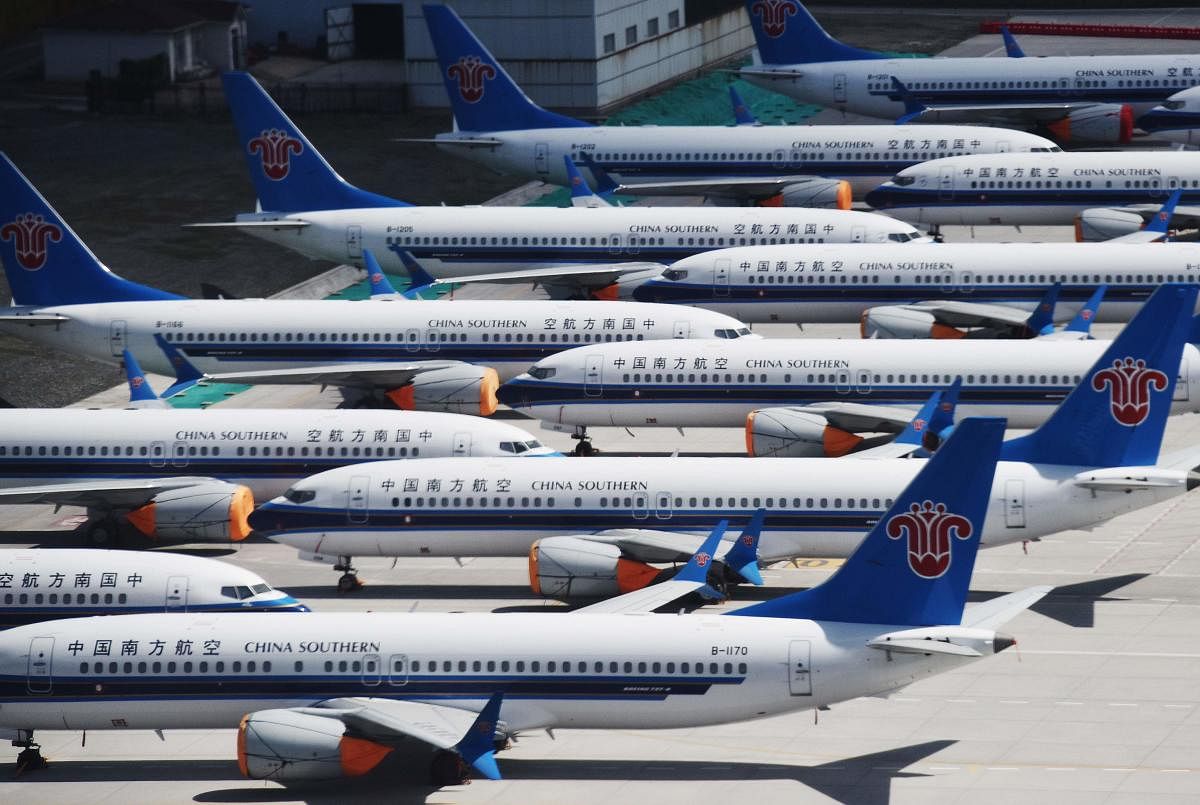 This photo taken on June 5, 2019 shows grounded China Southern Airlines Boeing 737 MAX aircraft parked in a line at Urumqi airport, in China's western Xinjiiang region. AFP