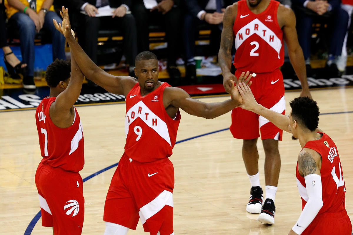 Serge Ibaka #9 of the Toronto Raptors celebrates the basket against the Golden State Warriors during Game Four of the 2019 NBA Finals at ORACLE Arena on June 07, 2019 in Oakland, California. (Photo by AFP)
