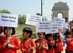 Schoolchildren hold placards as they take part in a rally to protest against pollution and urge others to protect the environment near India Gate in New Delhi on March 10, 2010. AFP