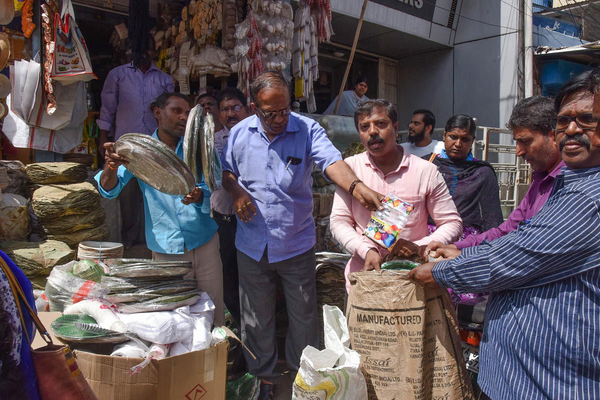 Karnataka State Pollution Control Board and BBMP officials seize plastic items from a shop on GP Street shops in Bengaluru on June 6, 2018. DH PHOTO/S K Dinesh
