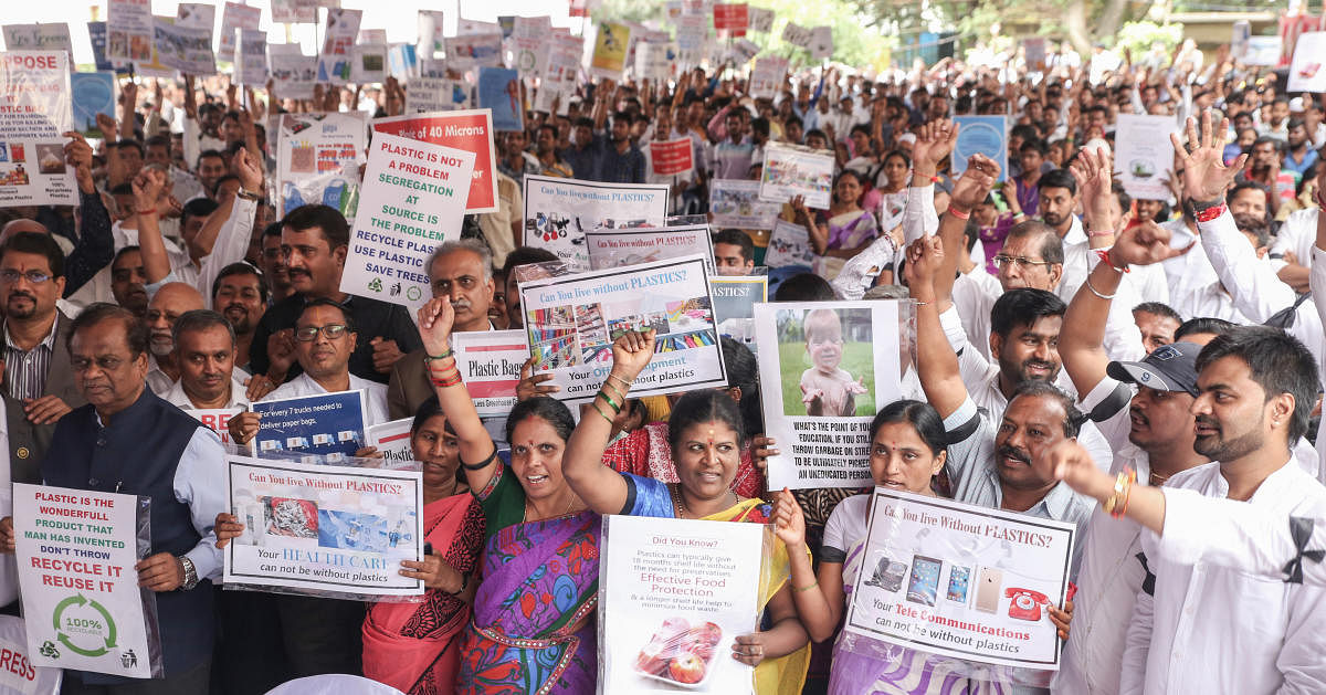 The members of the Karnataka State Plastic Association staged a protest against the plastic ban stating that the government's move is “unscientific” and “unjustified”, on Friday at the Freedom Park. DH photo