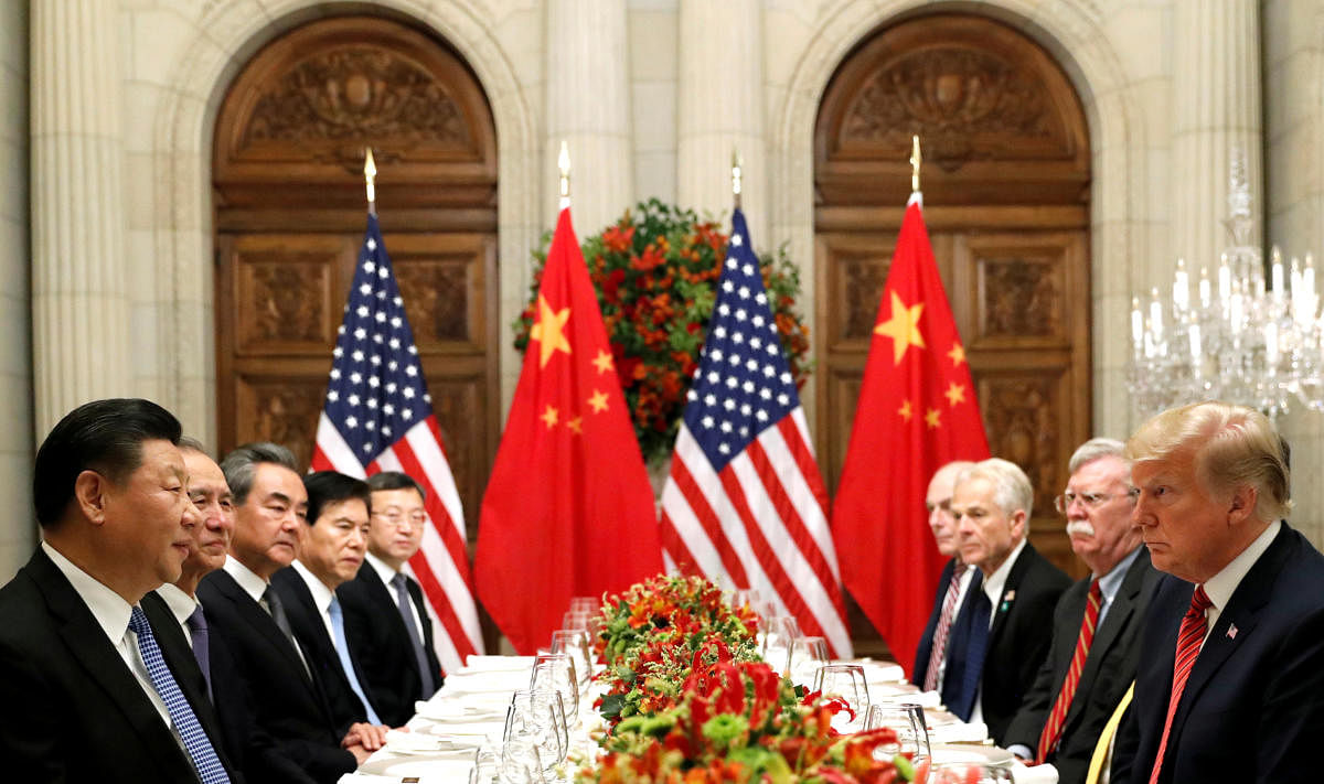 U.S. President Donald Trump, U.S. Secretary of State Mike Pompeo, U.S. President Donald Trump's national security adviser John Bolton and Chinese President Xi Jinping attend a working dinner after the G20 leaders' summit. (Reuters File Photo)