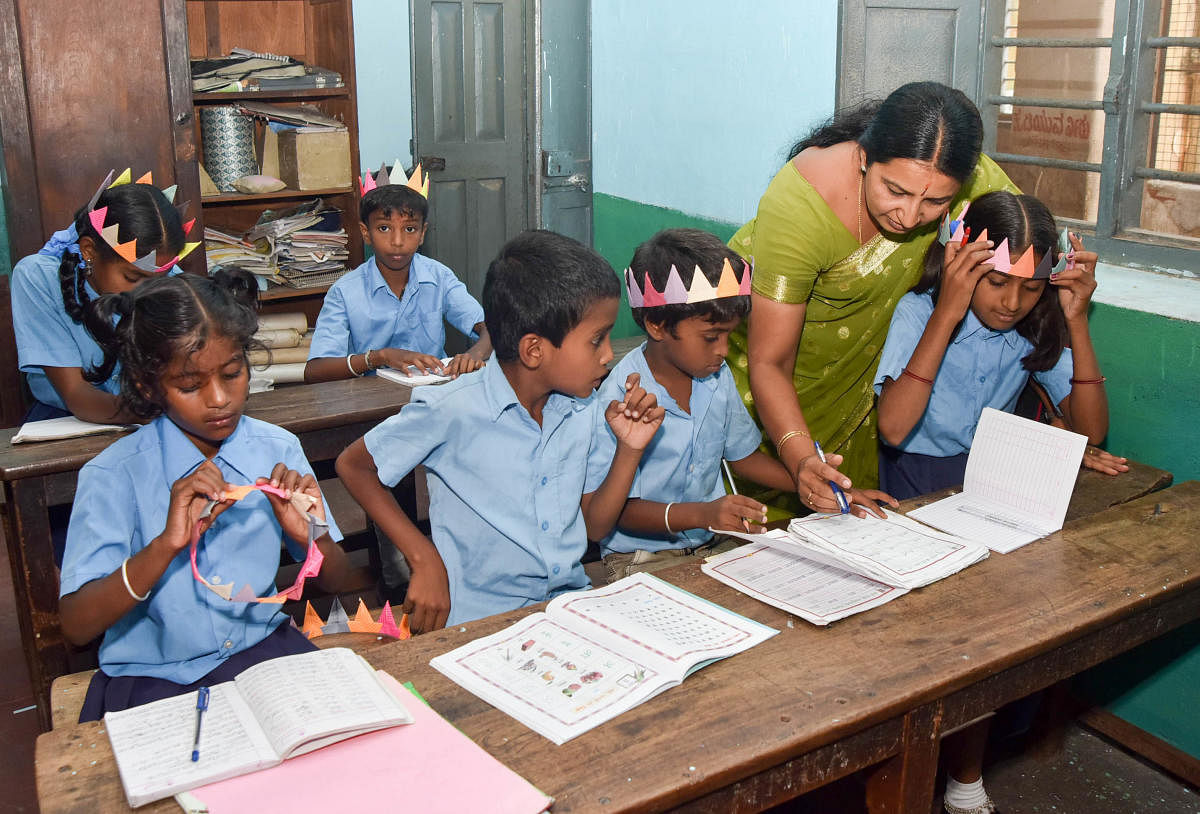 Students seen school on the first of new academic year start at Government School, Chamaraja Double Road in Mysuru. DH PHOTO / SAVITHA B R