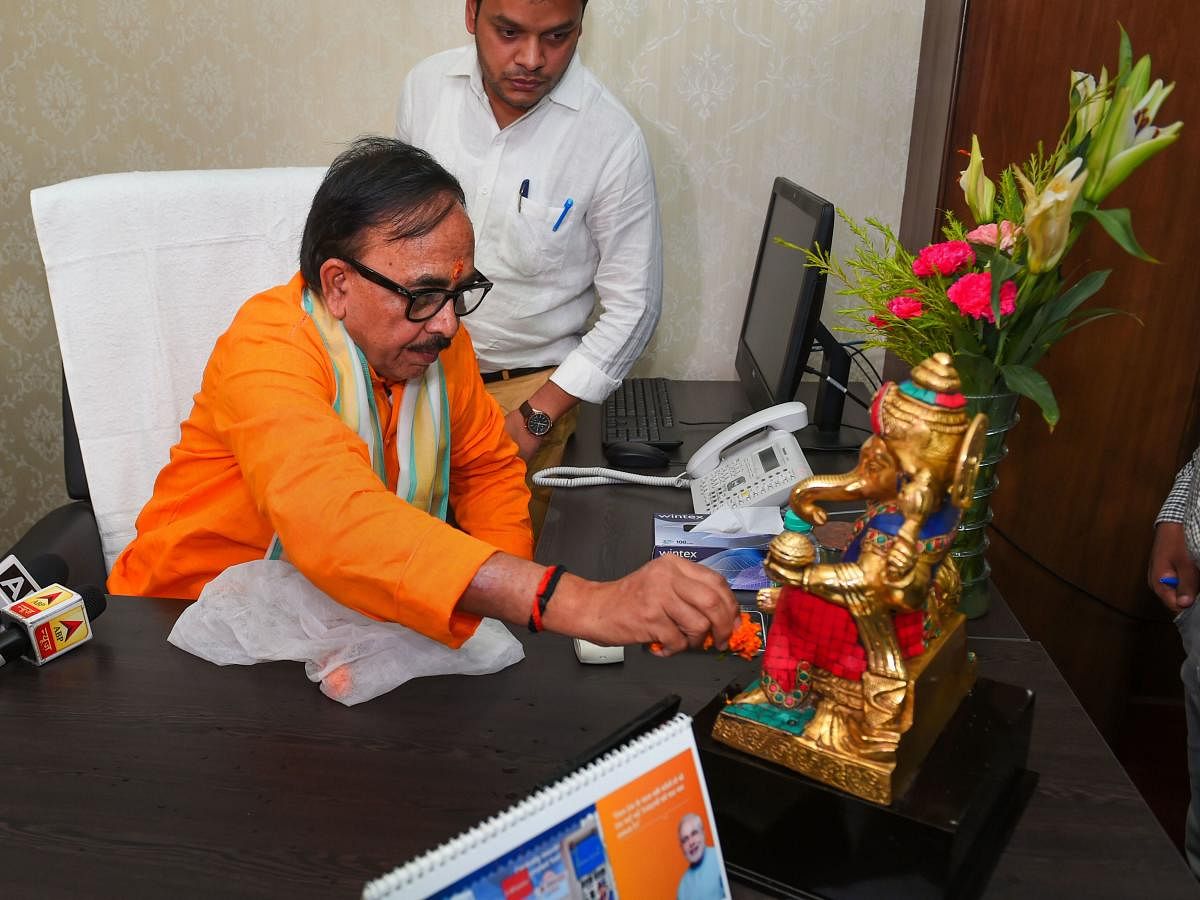 Uttar Pradesh BJP Chief Mahendra Nath Pandey offers prayers while assuming his office, in New Delhi, Tuesday, June 4 2019. He was appointed as the Union Minister of Skill Development and Entrepreneurship (PTI Photo/Shahbaz Khan) 