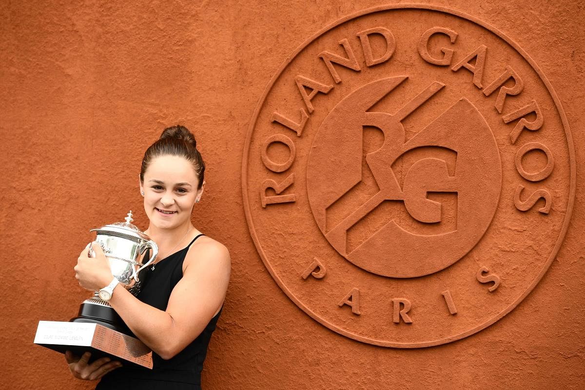 INSPIRING: Australia's Ashleigh Barty poses with the French Open trophy on Sunday. AFP