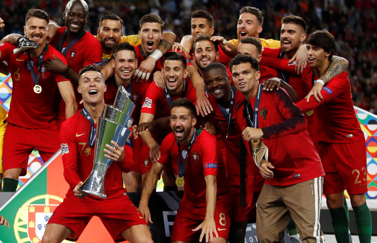 CHAMPIONS: Portugal celebrate with the the UEFA Nations League Final trophy on Sunday. Reuters
