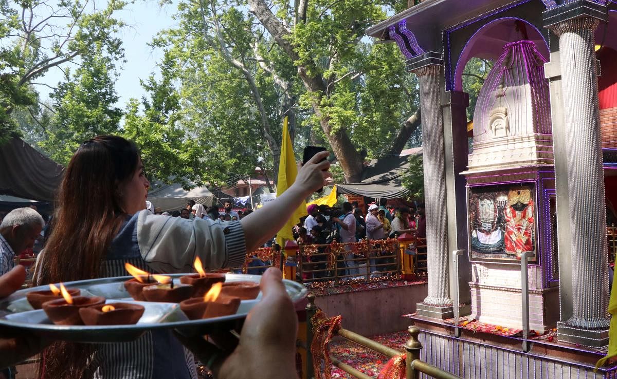 Nestled in the shade of mammoth Chinars, the temple received hordes of devotees with local Muslims welcoming them. The revered temple is thronged by devotees, mostly Kashmiri Pandits, every year for paying obeisance. (File Photo)