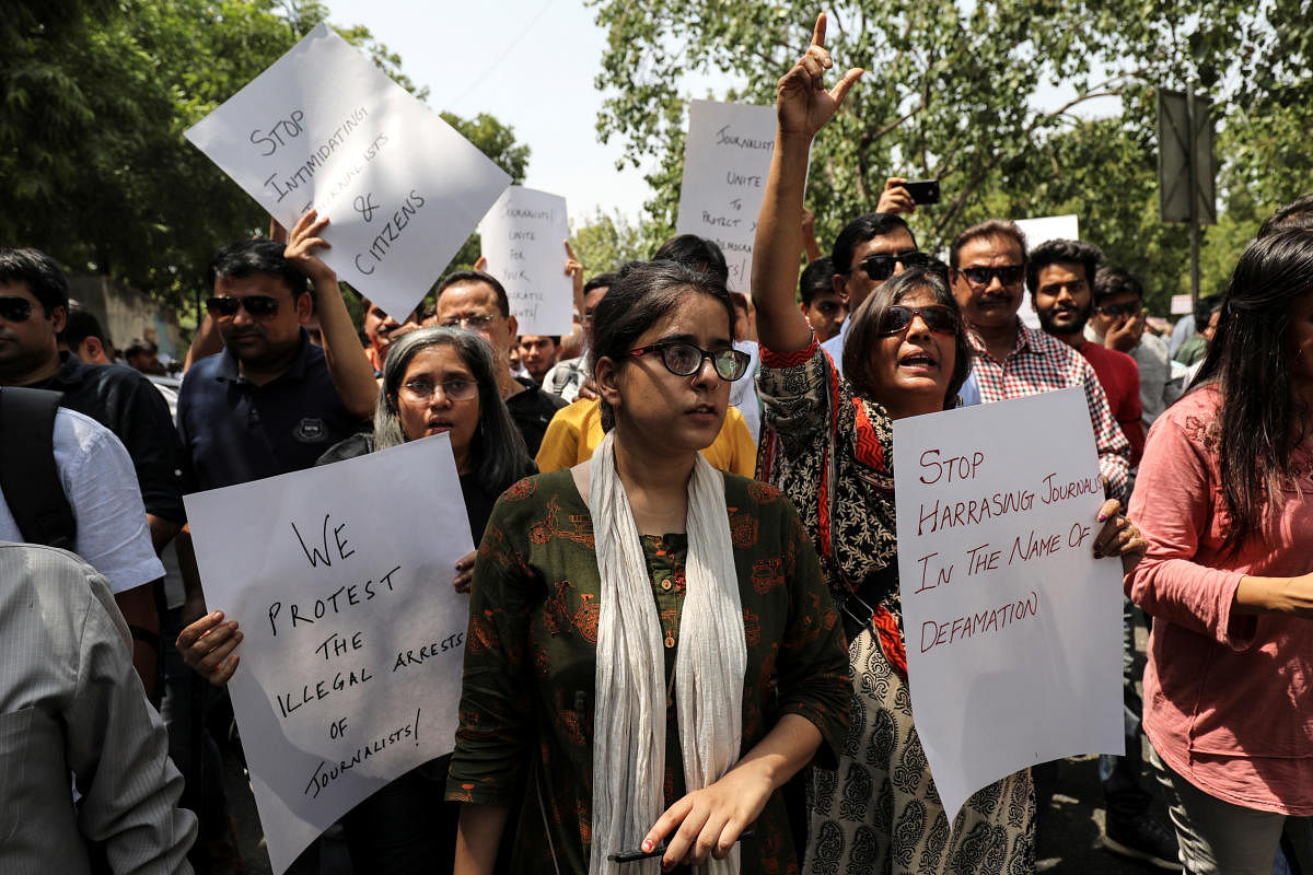 Jagisha Arora, wife of Prashant Kanojia, a journalist who was arrested for allegedly tweeting defamatory content against Uttar Pradesh's Chief Minister Yogi Adityanath, takes part in a protest with media members in New Delhi. (Reuters Photo)