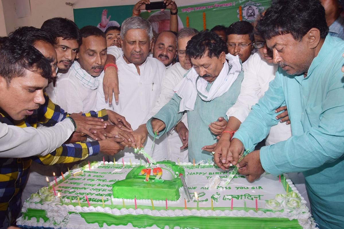 Patna: Rashtriya Janata Dal (RJD) workers celebrate the birthday of RJD chief Lalu Prasad Yadav, in Patna, Tuesday, June 11, 2019. (PTI Photo)
