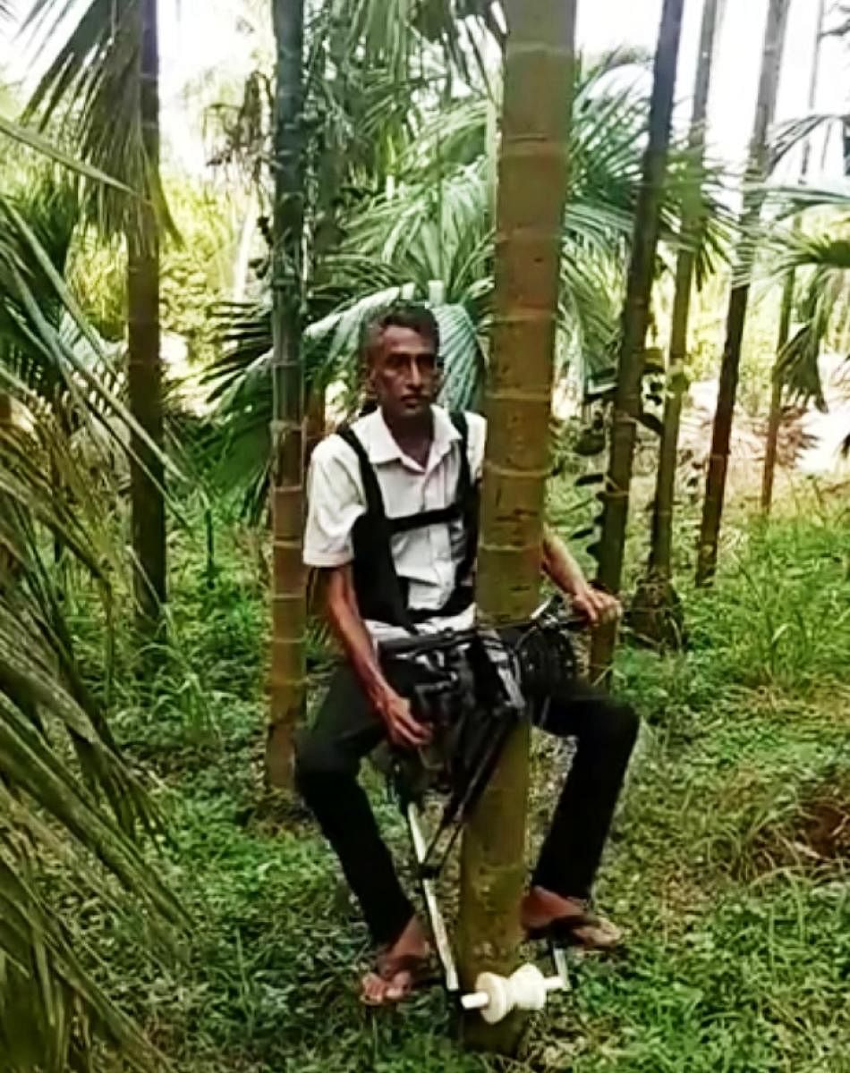 Farmer-turned-inventor K Ganapathi Bhat who developed a manned machine to climb arecanut trees.