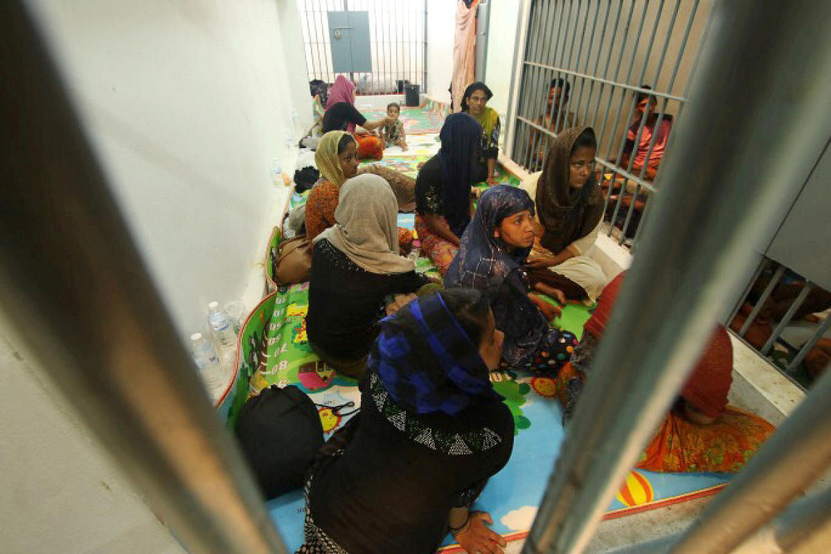 Rohingya people are seen detained in a police station after a fishing boat carrying more than sixty Rohingya refugees was found beached at Rawi island, part of Tarutao national park in the province of Satun, Thailand. (Reuters Photo)