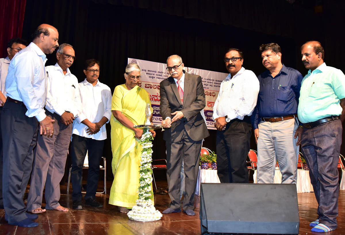 Principal District and Sessions Judge Kadluru Satyanarayana Acharya inaugurates a programme organised on the occasion of World Day Against Child Labour at Town Hall in Mangaluru on Wednesday. 