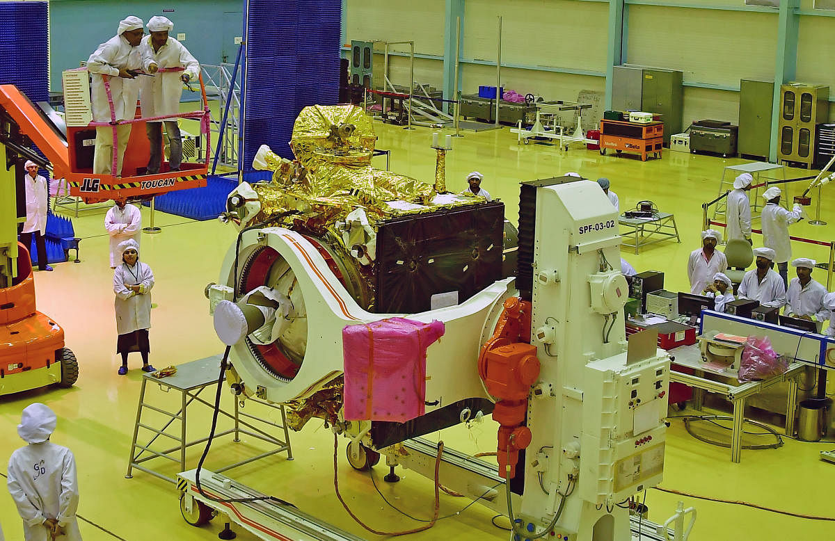 Isro personnel busy undertake the final stage of checking of the orbiter and lander of Chandrayaan-2 at the Isro satelite integration and testing establishment in Bengaluru on Wednesday. dh photo/Krishnakumar P S