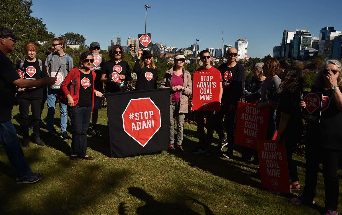 Anti-Adani coal mine protesters prepare to door knock residents to vote out climate change skeptic and former prime minister Tony Abbott in his affluent seat of Warringah in north Sydney ahead of the Australian election AFP file photo