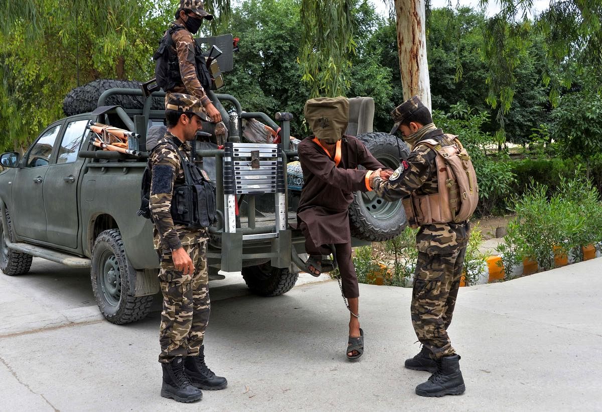 Forces with Afghanistan's National Directorate of Security (NDS) escort alleged Taliban and islamic state (IS) fighters after they are presented to media in Jalalabad. (AFP File Photo)