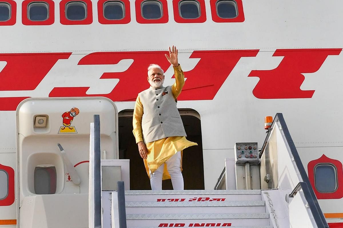 Prime Minister Narendra Modi waves as he emplanes for Bishkek, Kyrgyz Republic to attend a meeting of the Council of Heads of State of the Shanghai Cooperation Organization. PTI photo