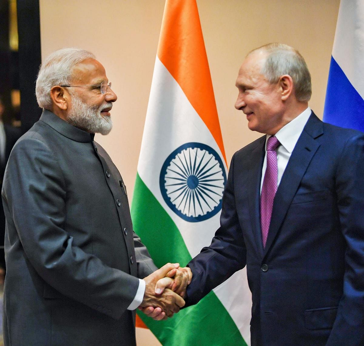 Narendra Modi shakes hands with Russian President Vladimir Putin during a meeting on the sidelines of the Shanghai Cooperation Organisation (SCO) Summit in Bishkek. (PTI Photo)