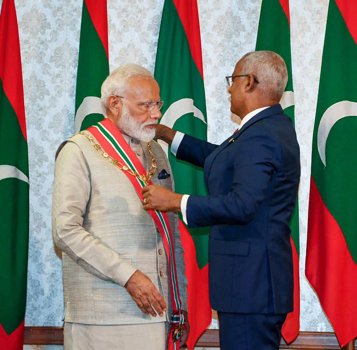 Prime Minister Narendra Modi receives the Maldives Highest Honour Order of the Distinguished Rule of Nishan Izzuddeen from President of Maldives Ibrahim Mohamed Solih at Male, in Maldives. PTI