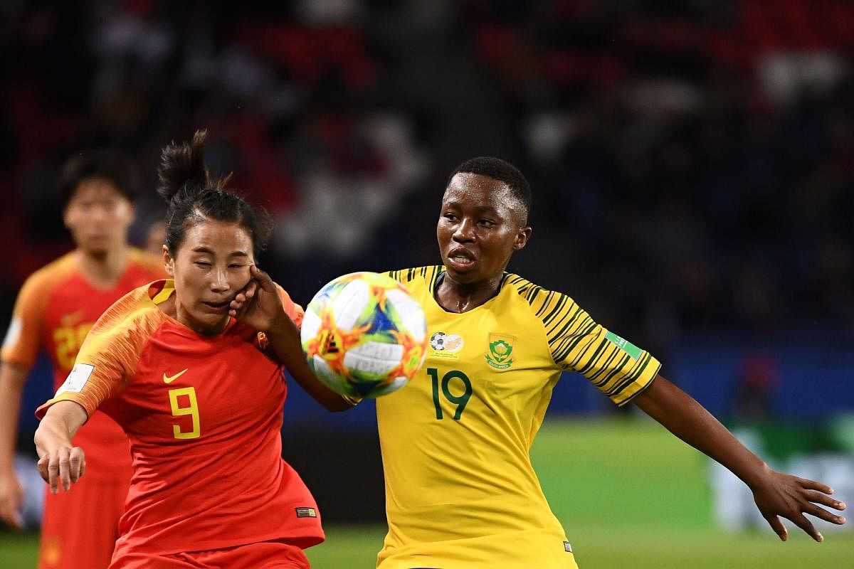 China's forward Li Yang (L) vies with South Africa's midfielder Kholosa Biyana during the France 2019 Women's World Cup Group B football match between South Africa and China. (Photo AFP)