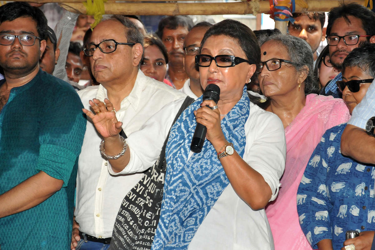 Veteran actor and filmmaker Aparna Sen addresses junior doctors during their strike in protest against an attack on an intern doctor, at Nil Ratan Sircar Medical College and Hospital in Kolkata. (PTI Photo) 