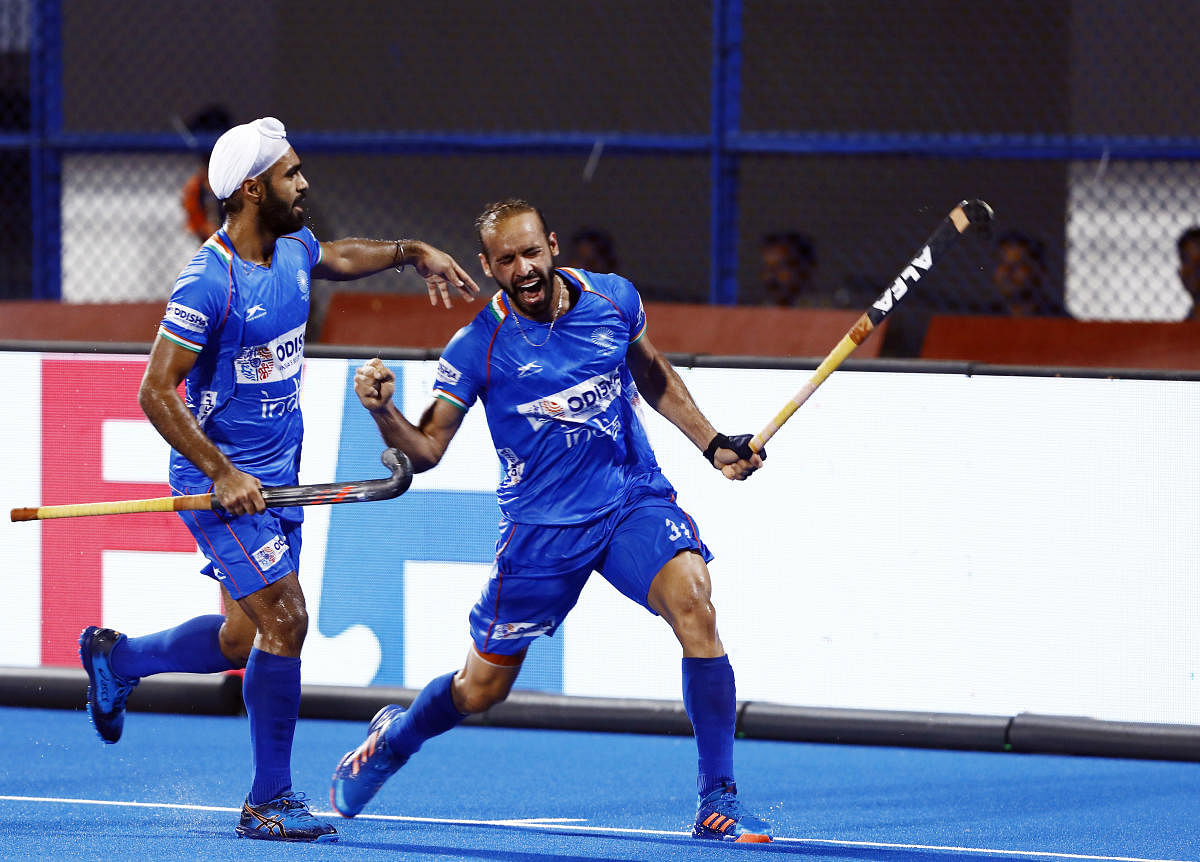 Ramandeep Singh celebrates with a team-mate after scoring against Japan on Friday. FIH media