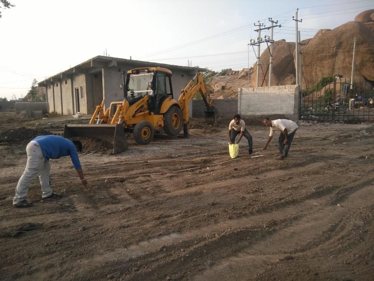 Community effort: People clearing the graveyard in Koppal town.