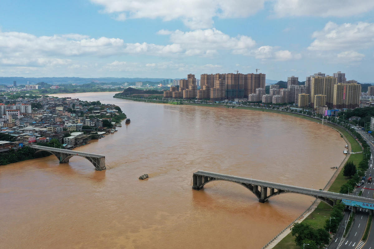 A section of a bridge spanning Dongjiang river is seen collapsed in Heyuan, Guangdong province, China. Reuters photo
