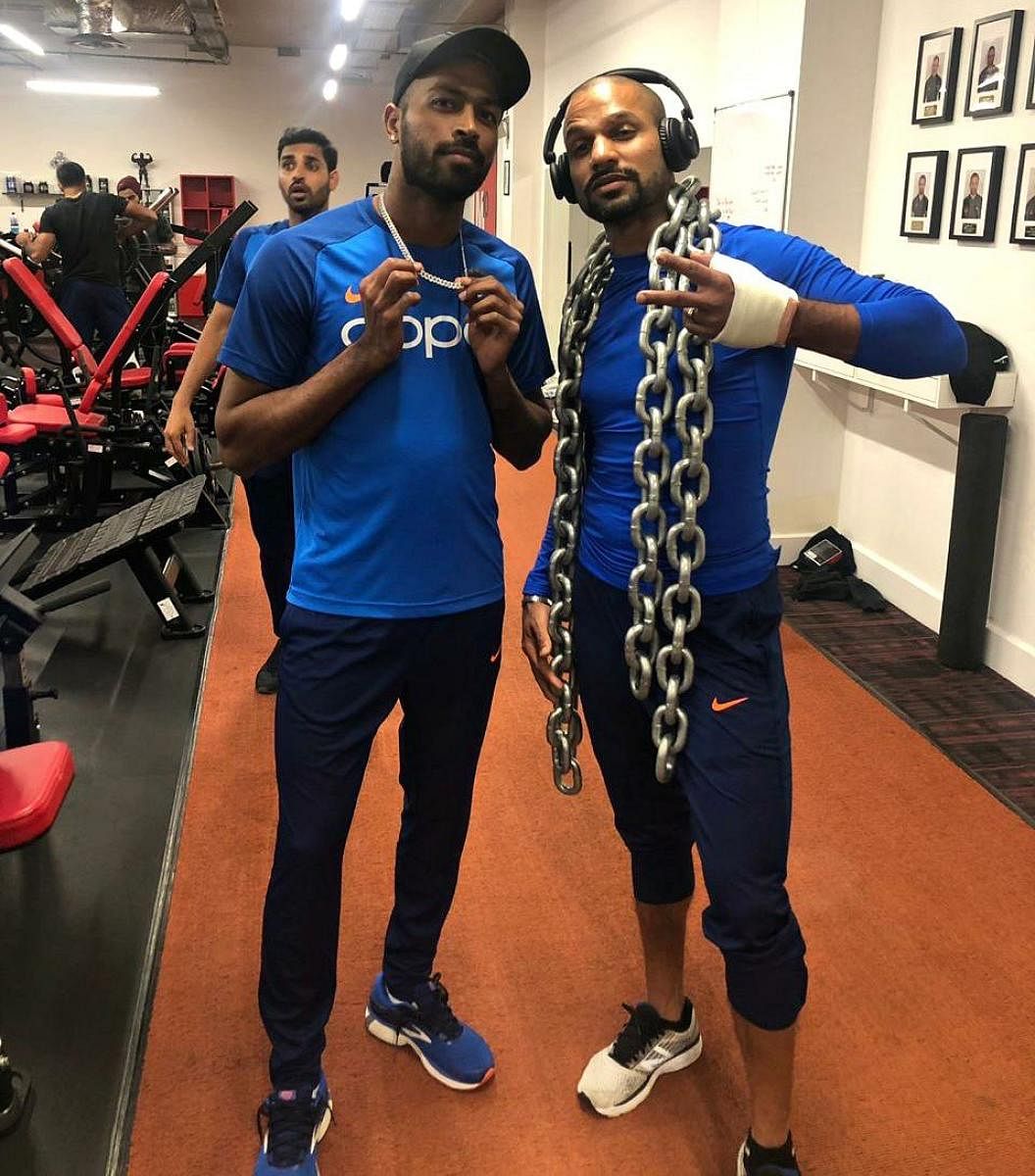 MAKING WORKOUTS FUN India’s injured opener Shikhar Dhawan (right) shares a light moment with Hardik Pandya at the gym on Friday. REUTERS
