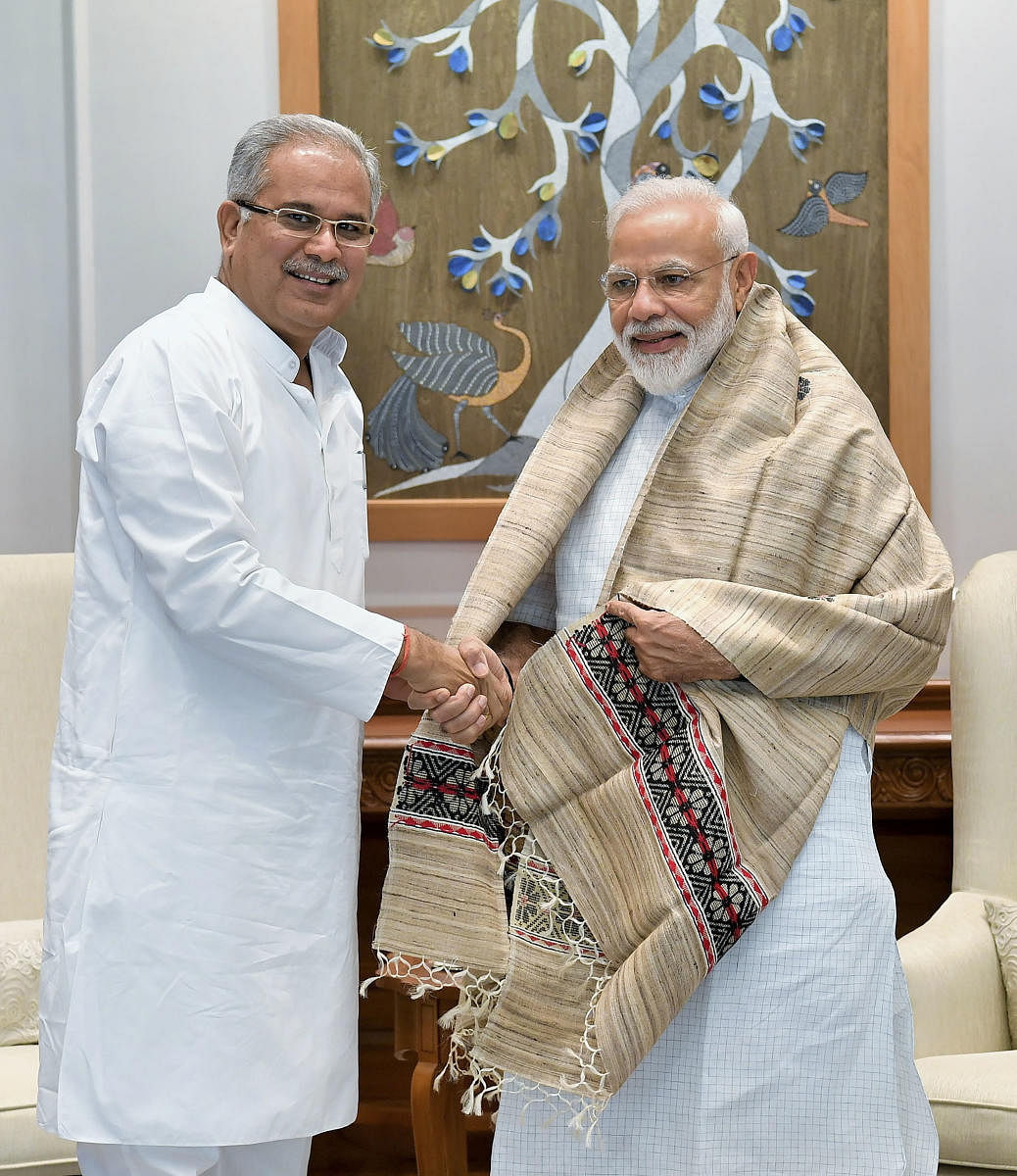 Prime Minister Narendra Modi being greeted by Chief Minister of Chhattisgarh Bhupesh Baghel during a meeting, New Delhi, Saturday, June 15, 2019. (PTI Photo)