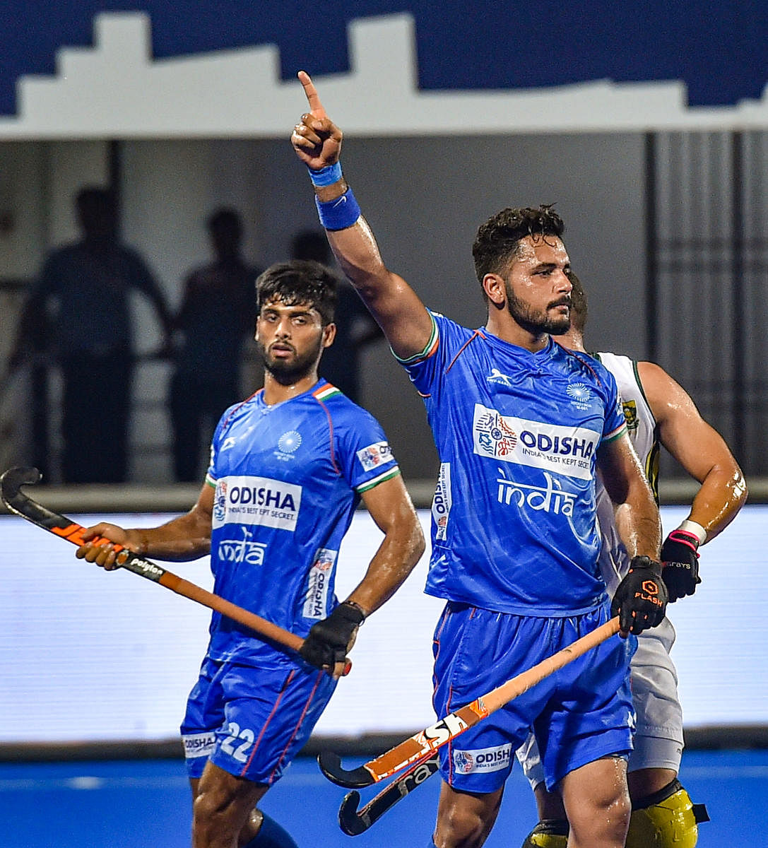 CLINICAL: India's Harmanpreet Singh (right) celebrates after scoring a goal against South Africa during the title clash of the FIH Series Finals in Bhubaneswar on Saturday. PTI  