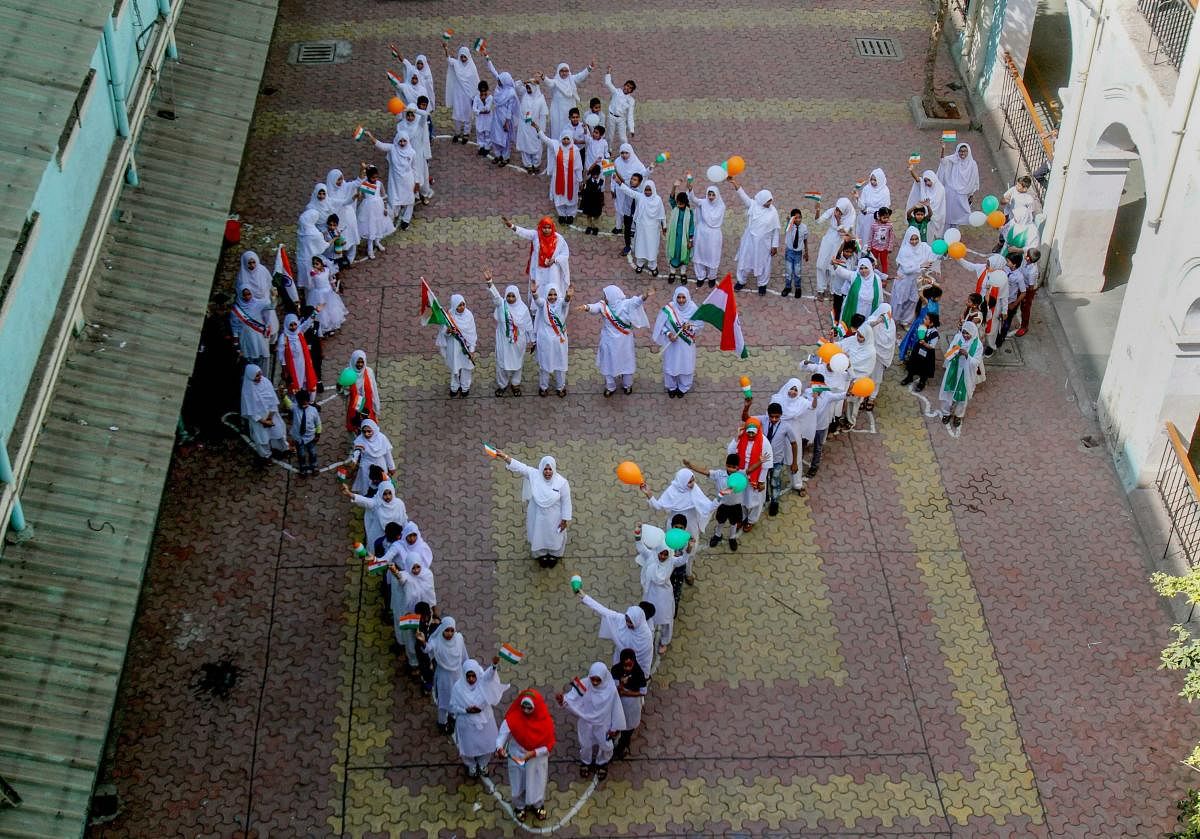School students form the map of India during Republic Day celebrations, in Mumbai. PTI