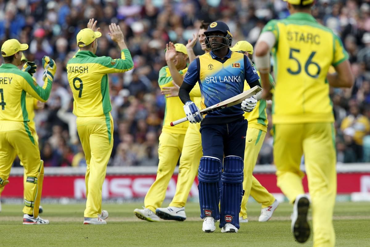 Sri Lanka's Angelo Mathews leaves the crease as he loses his wicket for nine during the 2019 Cricket World Cup group stage match between Sri Lanka and Australia at The Oval in London on June 15, 2019. (AFP)