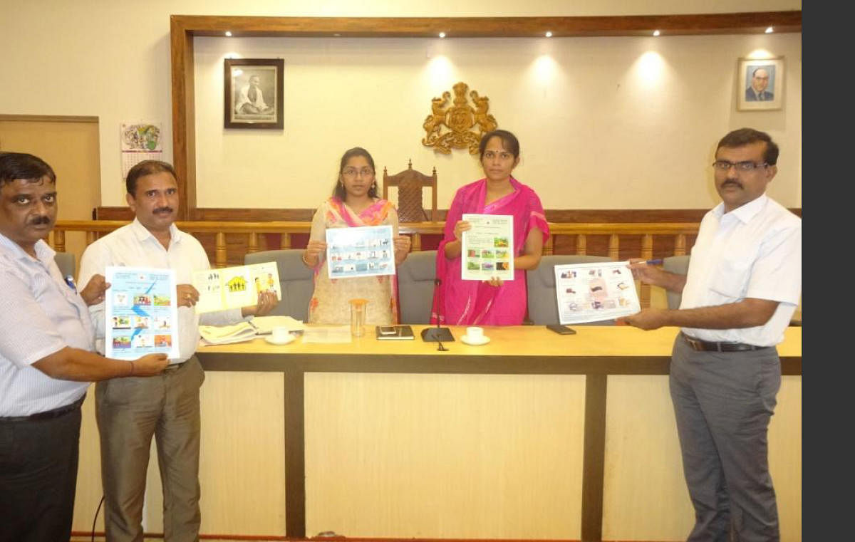 Kodagu Deputy Commissioner Annies Joy released the poster on emergency measures at her office on Saturday.