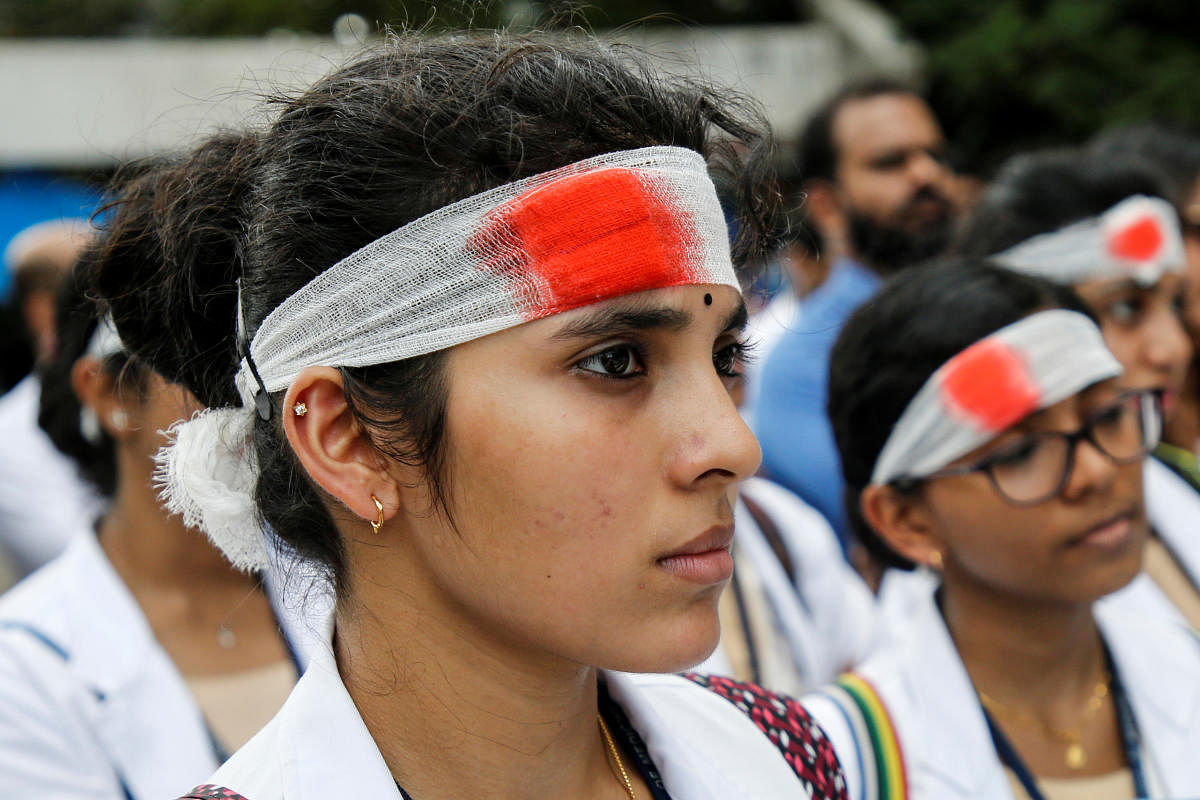Medical students wearing mock bandages participate in a protest called by Indian Medical Association (IMA), during a nationwide doctors strike in Kochi, India. (Photo REUTERS)