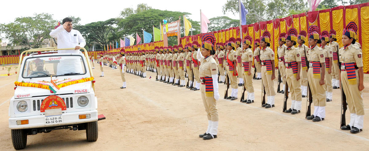 Home Minister M B Patil receives the guard of honour during the passing out parade of 52nd batch of women warders in Mysuru on Monday.