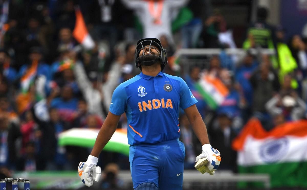 Rohit Sharma celebrates after scoring a century (100 runs) during the 2019 Cricket World Cup. (AFP Photo)