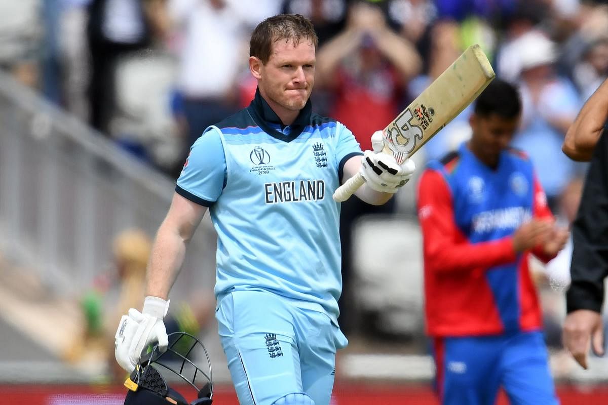 England's captain Eoin Morgan celebrates his century during the 2019 Cricket World Cup group stage match between England and Afghanistan at Old Trafford in Manchester, northwest England, on June 18, 2019. AFP
