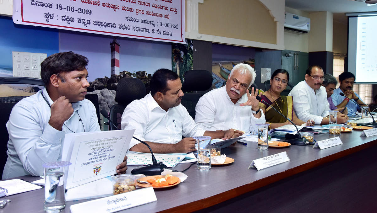 Revenue Minister R V Deshpande addresses a meeting at the deputy commissioner’s office in Mangaluru on Tuesday.