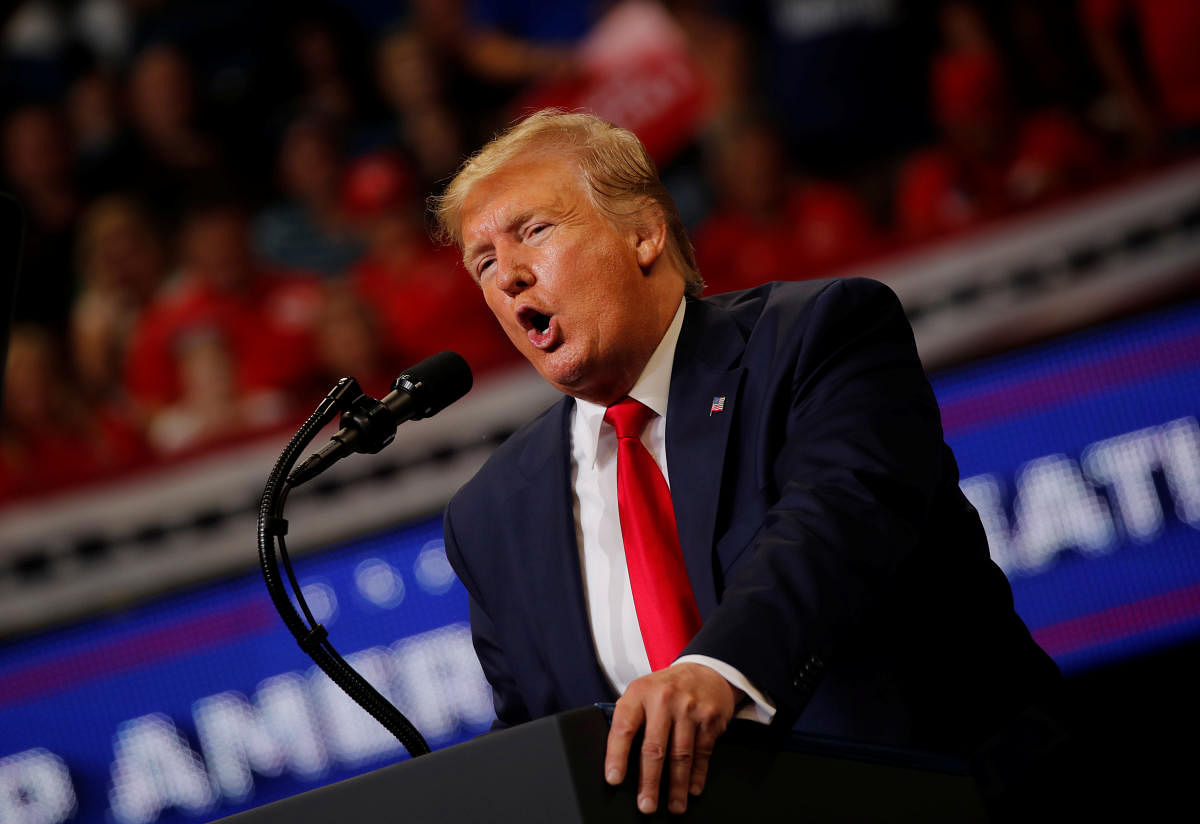 US President Donald Trump speaks on stage formally kicking off his re-election bid with a campaign rally in Orlando, Florida, June 18, 2019. (REUTERS)