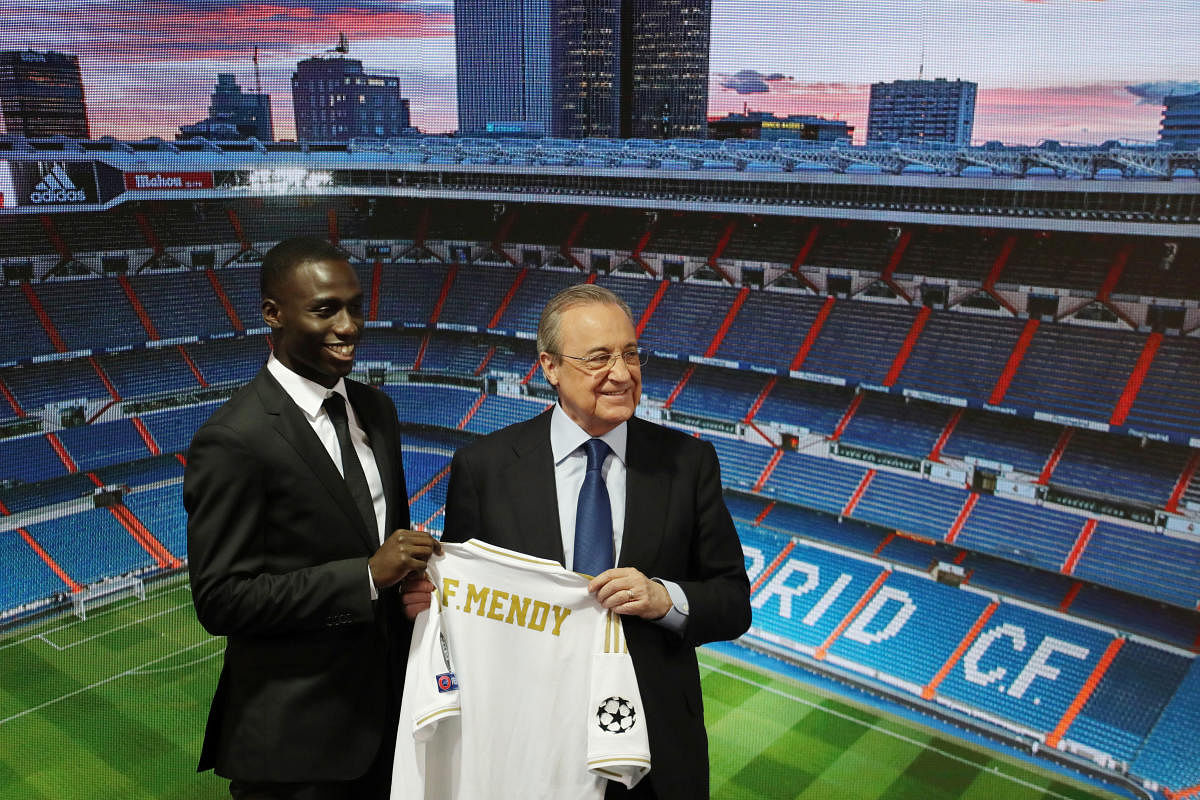 Real Madrid's Ferland Mendy poses with president Florentino Perez during the presentation. (Reuters Photo)