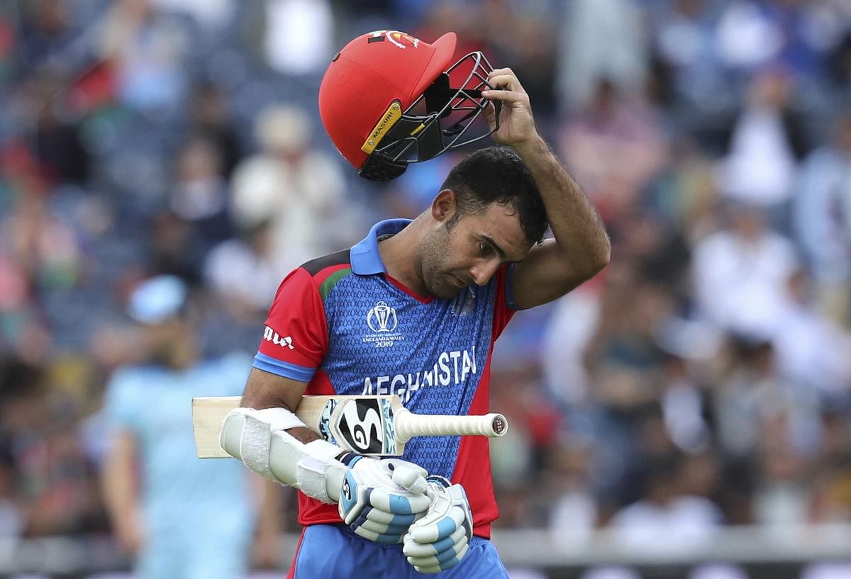 Manchester: Afghanistan's Hashmatullah Shahidi leaves the field after being dismissed during the Cricket World Cup match between England and Afghanistan at Old Trafford in Manchester. (PTI Photo)